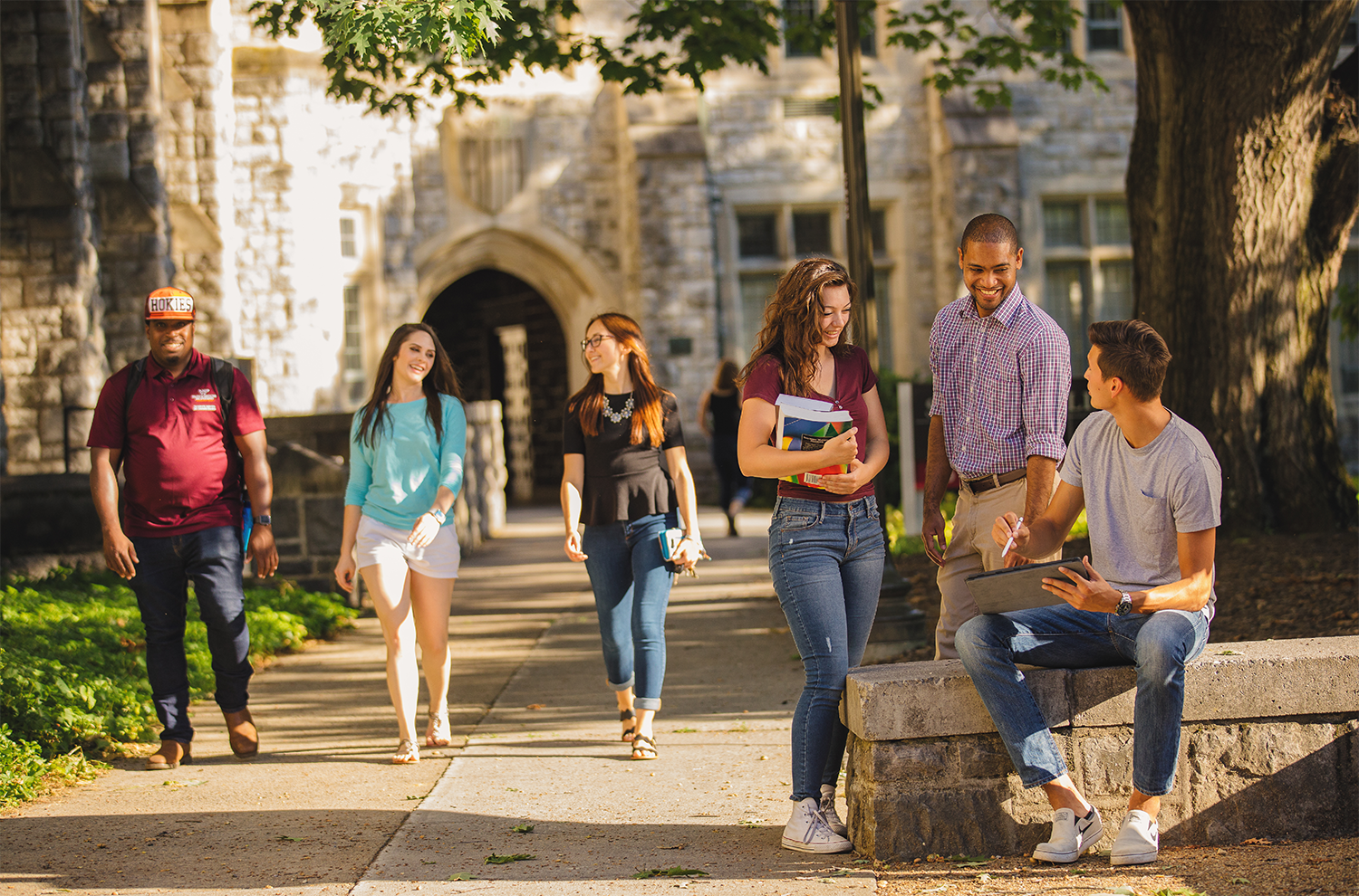 Image of students smiling and talking on Virginia Tech campus